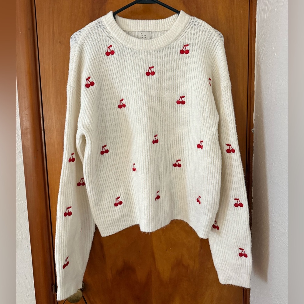 a new day White Sweater with Red Cherry Design